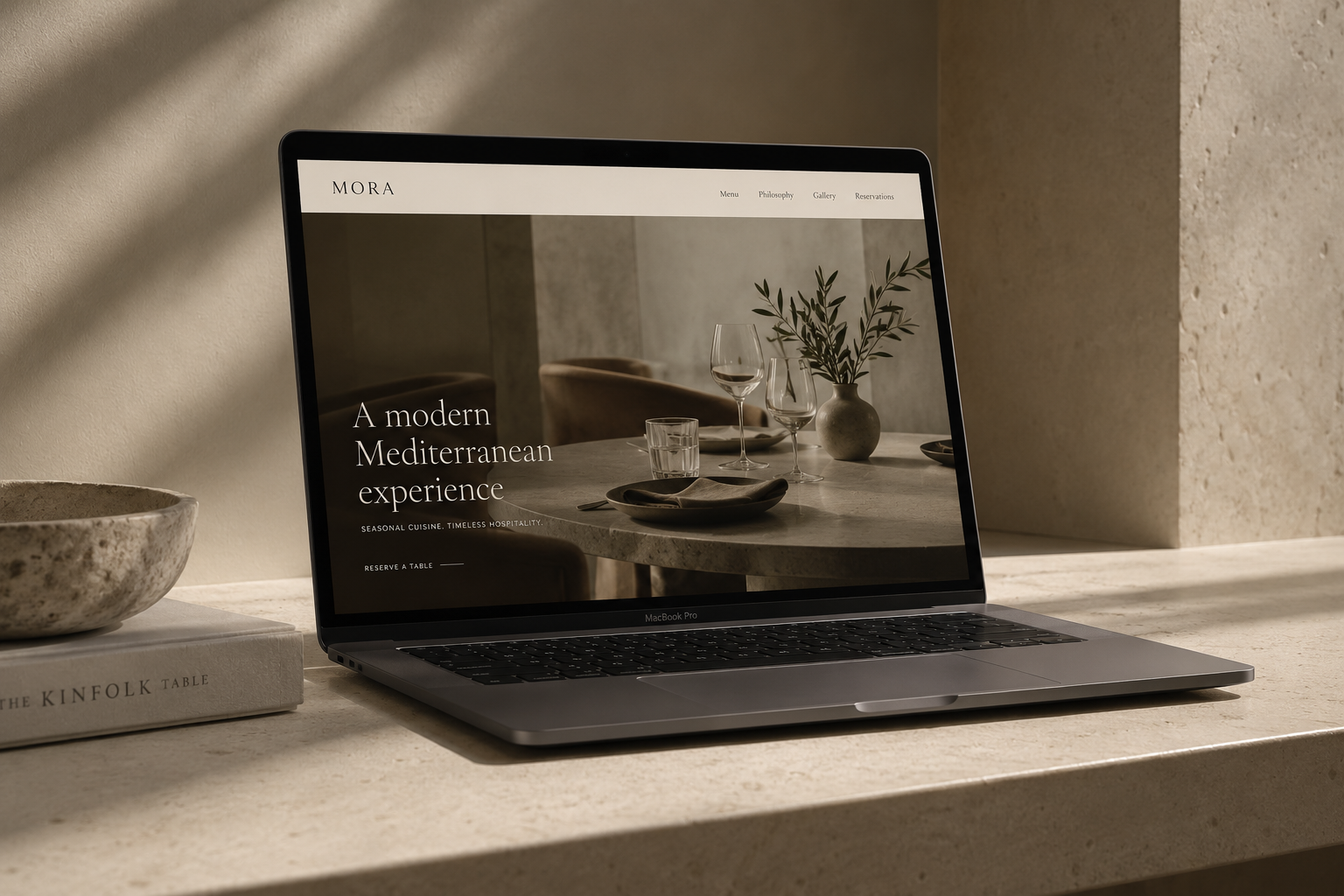 Laptop mockup showing a refined, minimal website design for a modern Mediterranean restaurant