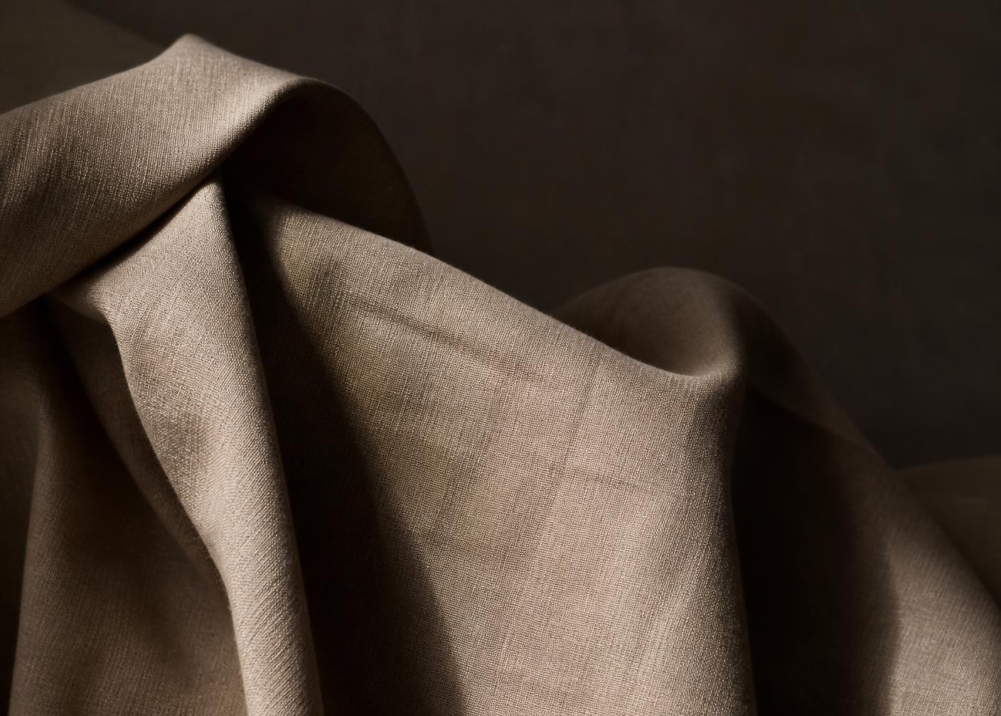 Soft natural light across a textured surface, representing Arqive Studio photography and film